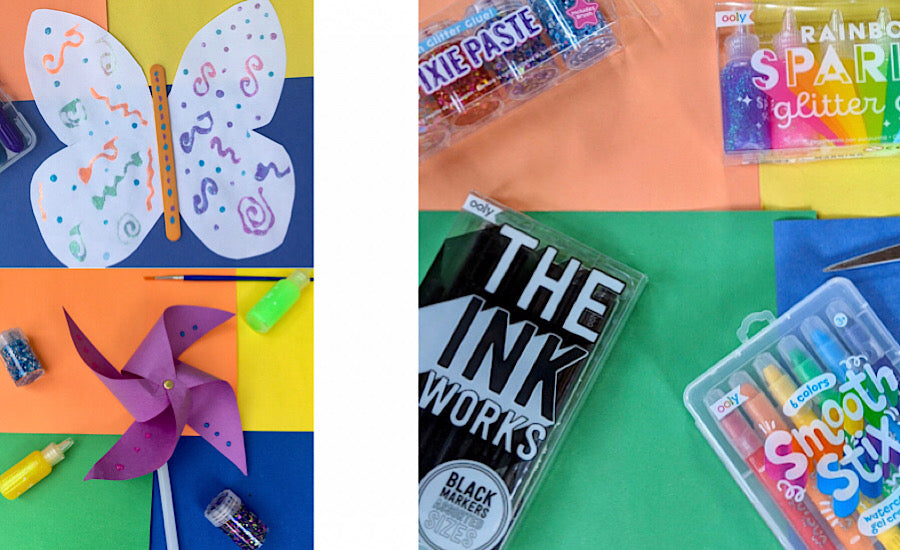 purple pinwheel, white butterfly and art supplies on colorful background