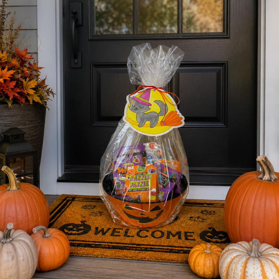 Finished Boo basket filled with OOLY product sitting on the front porch