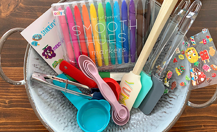 art supplies and cooking utensils in colander