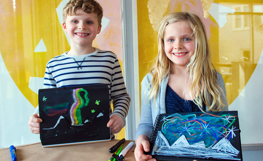 Create your own Northern Lights scene on black paper with Rainy Dayz Crayons.