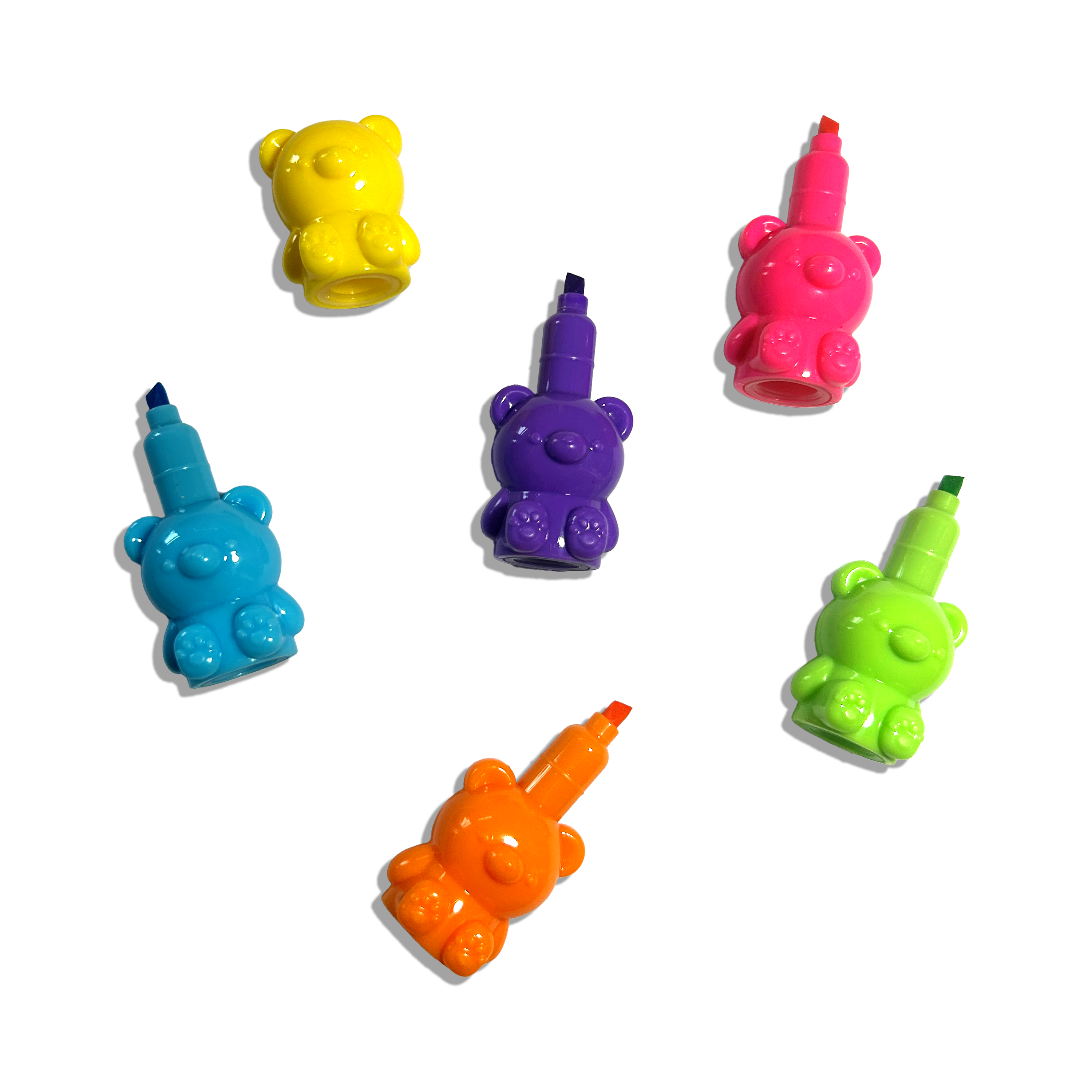 Separated individual highlighters from an OOLY Bear Besties Stacking Highlighters on a white background