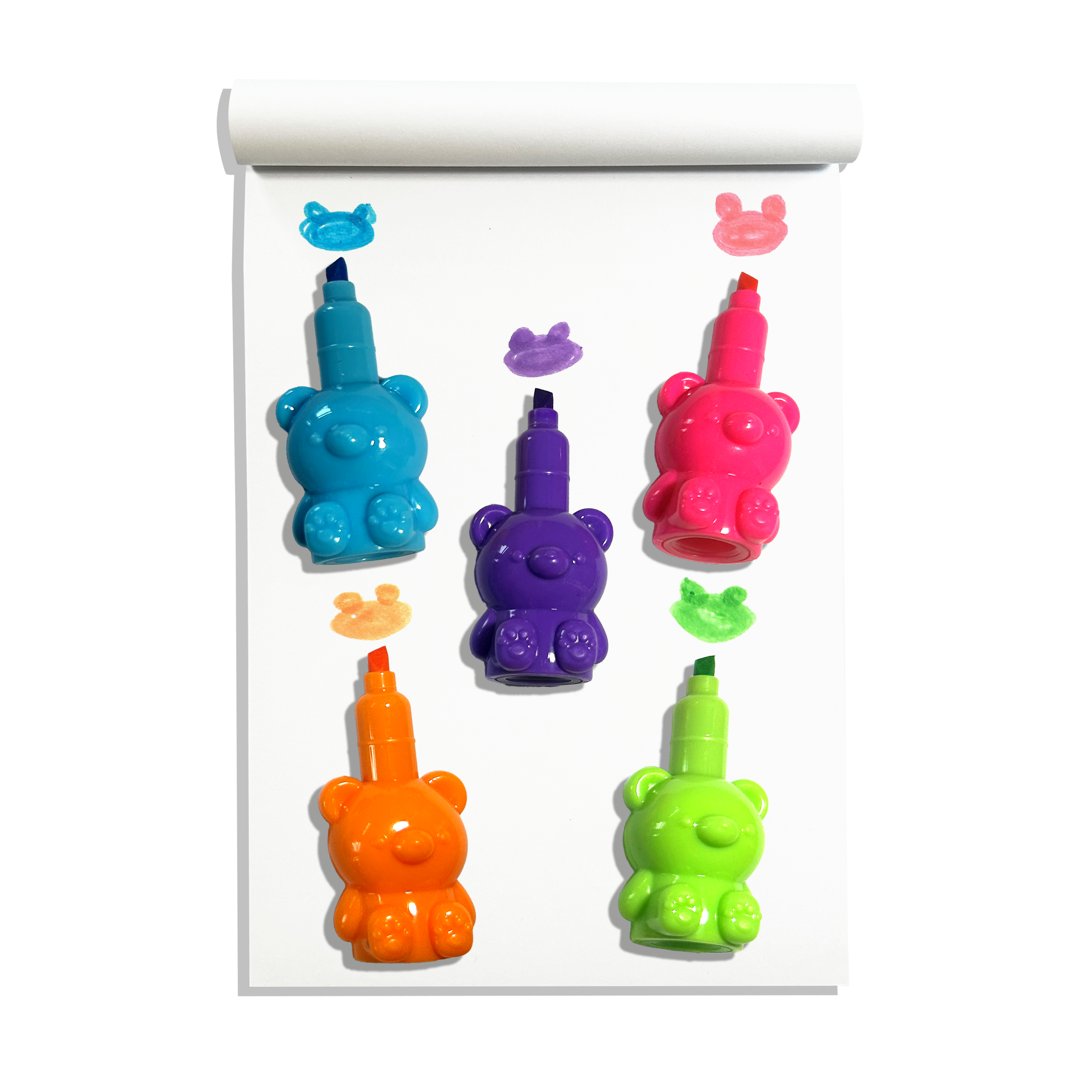 Individual OOLY Bear Besties Stacking Highlighters on a white sketchbook showing bear shaped color swatches