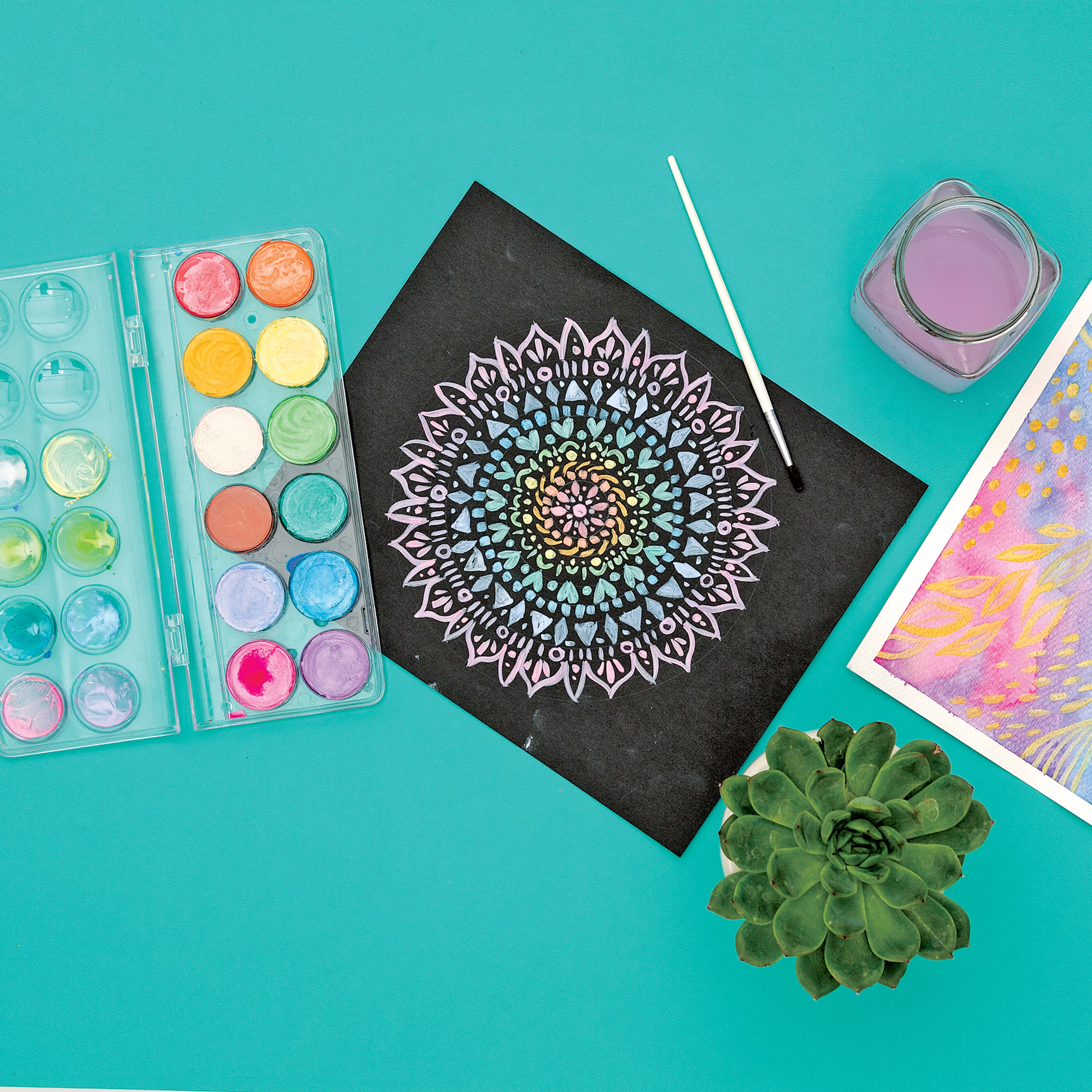 Mandala design on black paper painted with OOLY Chroma Blends pearlescent watercolor paints