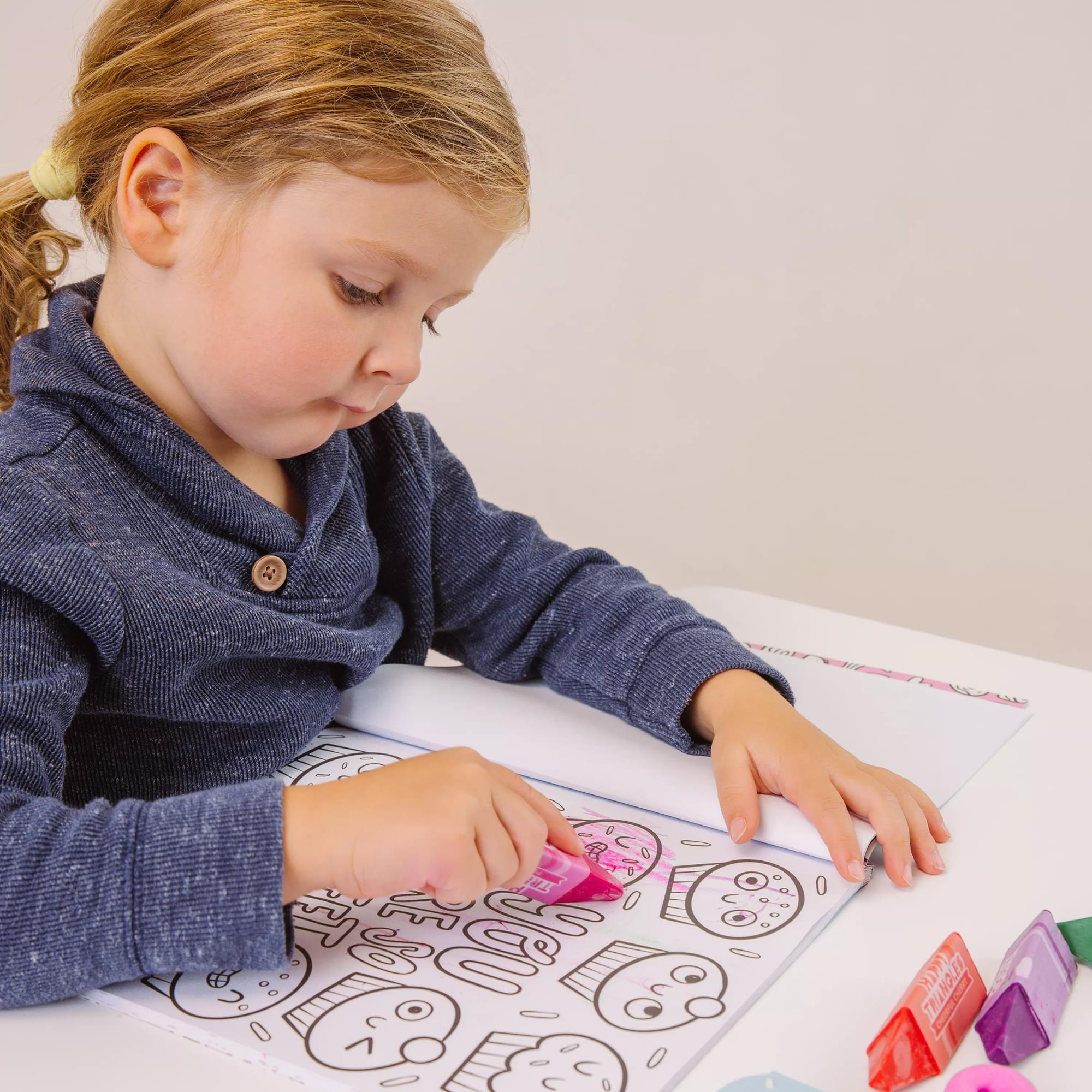 Girl coloring in OOLY Color-In Book Coloring Book Happy Snacks 