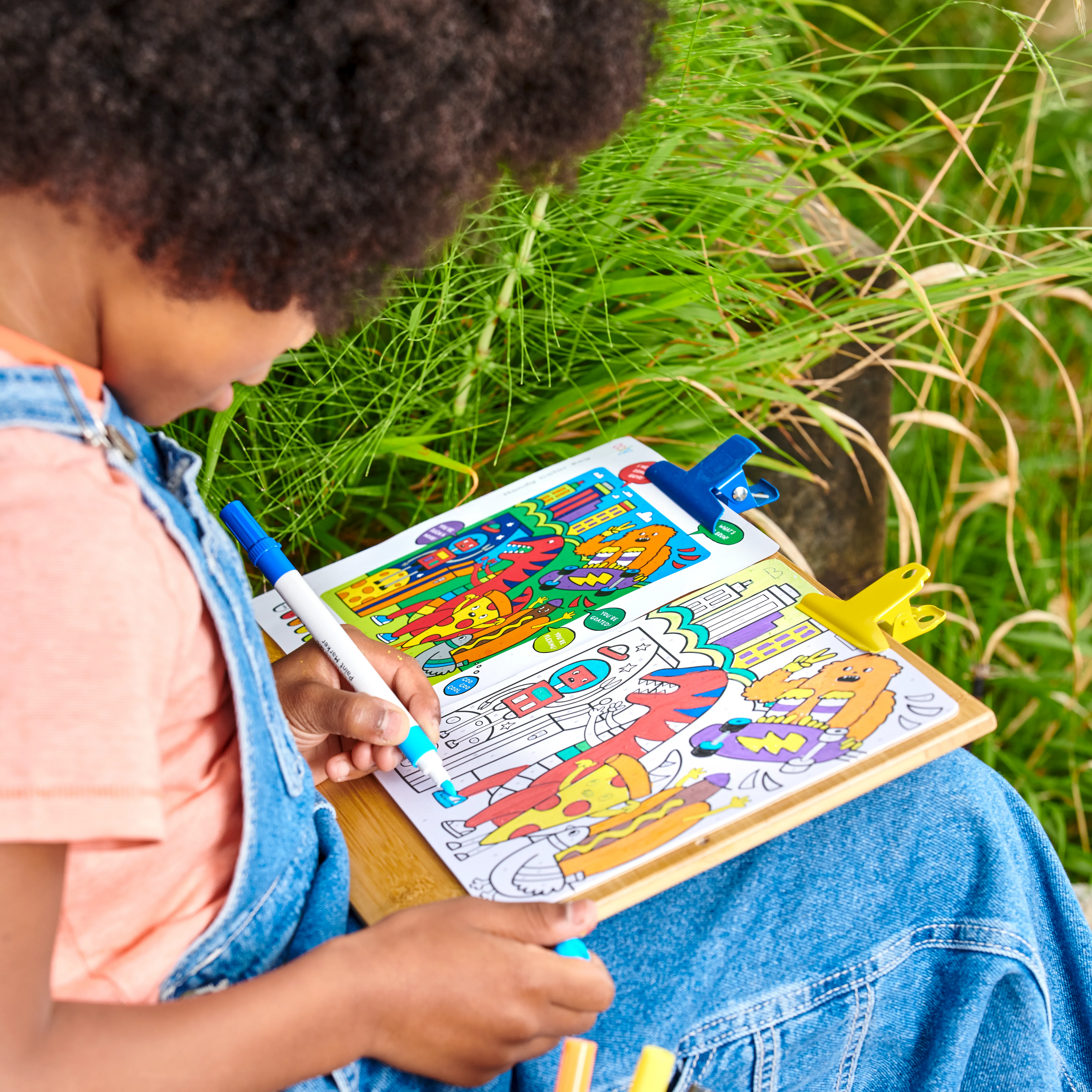 Kid painting on paint card from OOLY Colortopia Color By Number Paint Marker Kit - Epic Adventures set