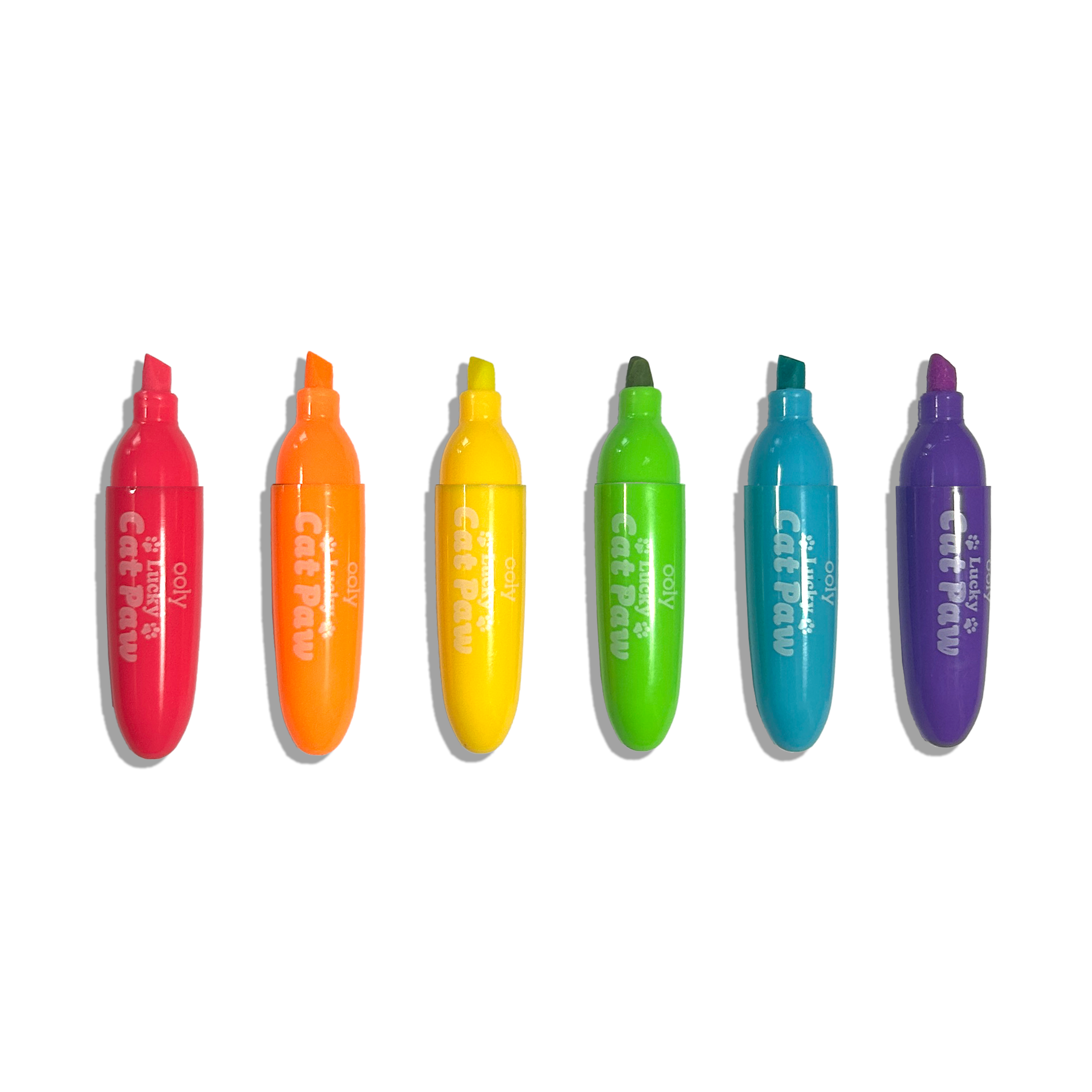 Row of uncapped OOLY Lucky Cat Paw Scented Neon Highlighters on a white background