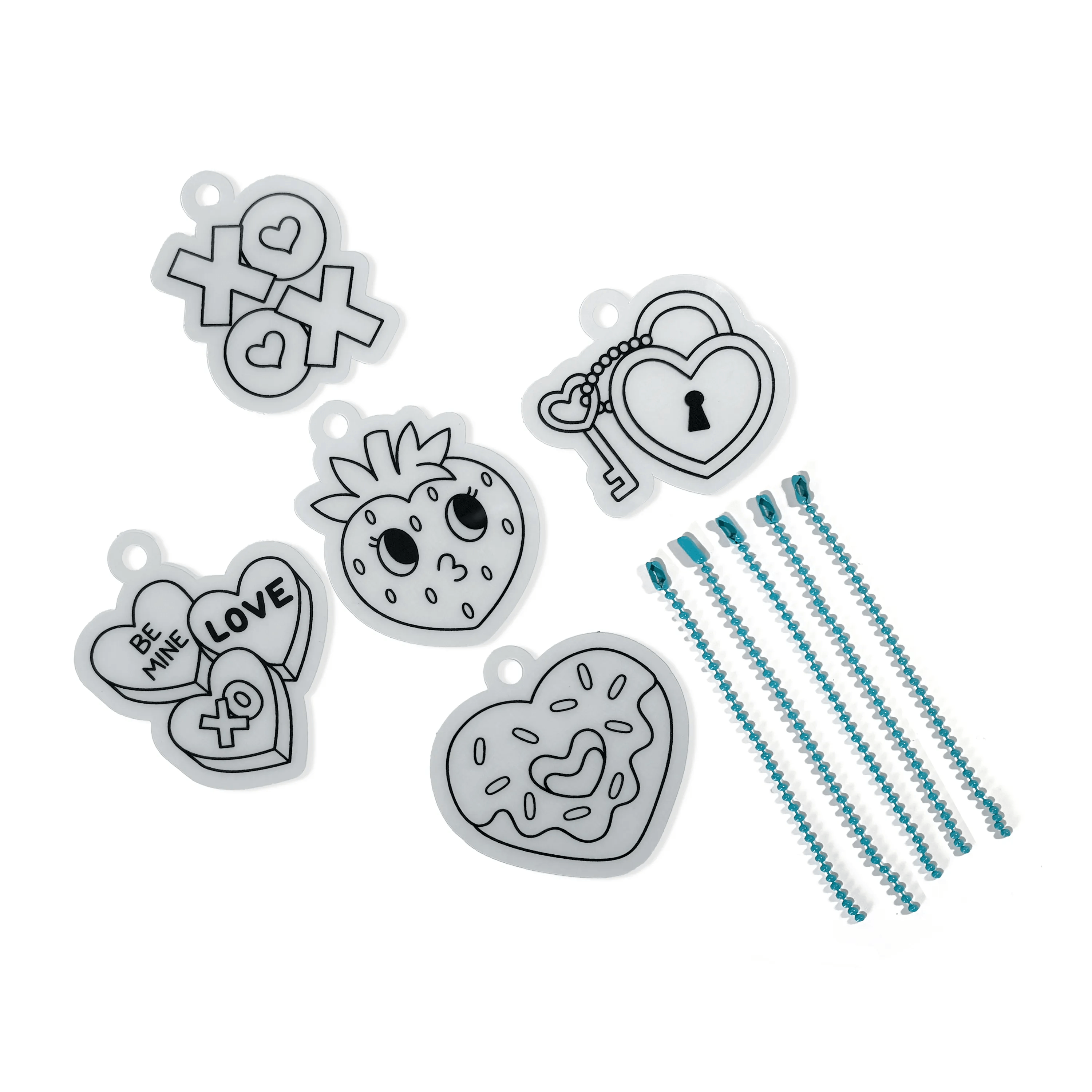 Contents of OOLY Mini Shrink-Its! DIY Shrink Art Kit - Hugs & Kisses with uncolored charms and beads