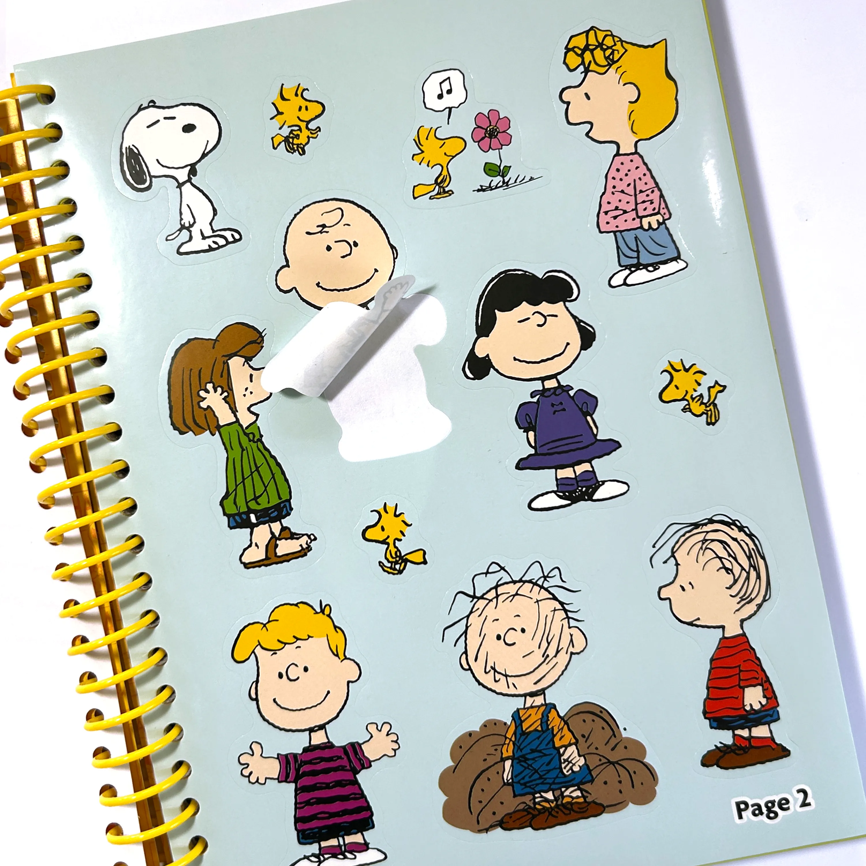 Sticker sheet of Peanuts characters from the OOLY x Peanuts Coloring Activity & Sticker Kit