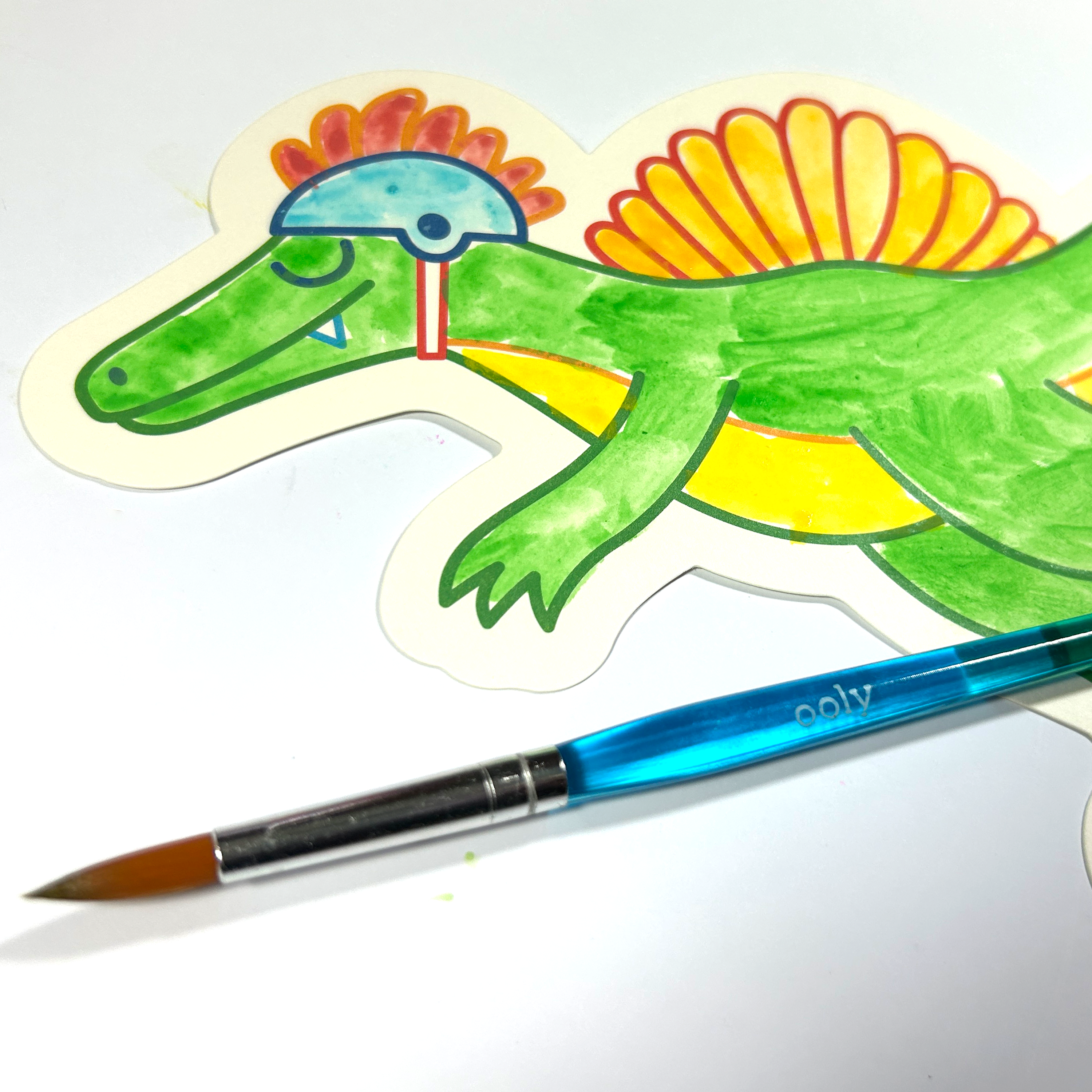 Close up of watercolor painted dinosaur from the OOLY Chills and Thrills Dinos Playful Painters Easy Watercolor Painting Kit
