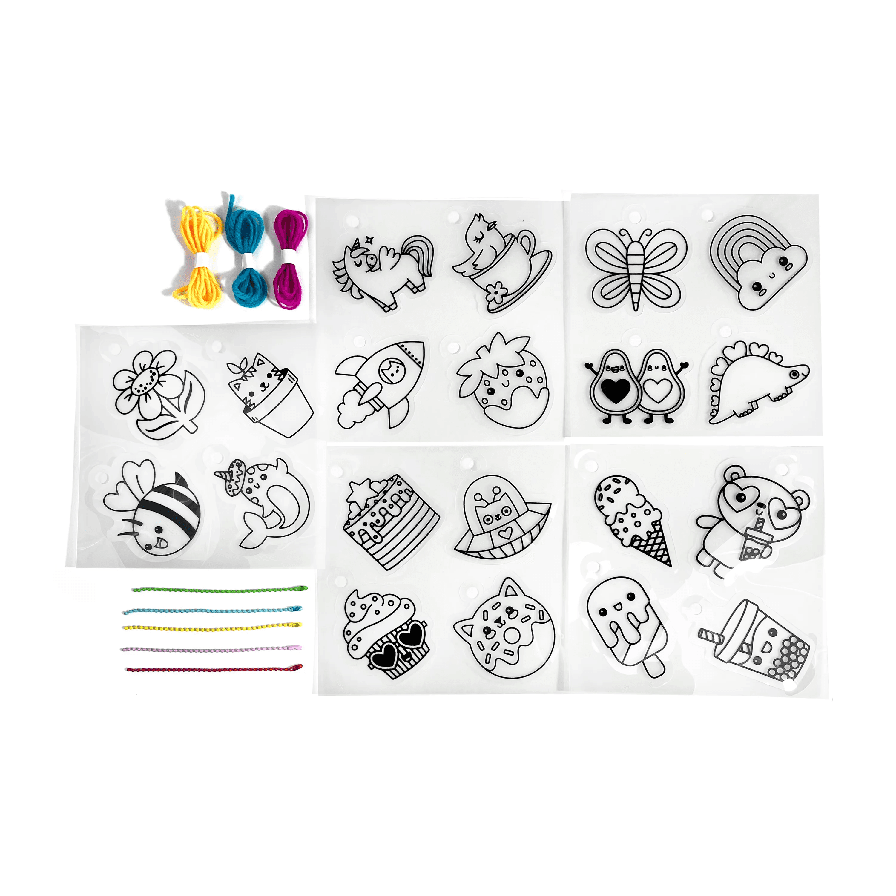 Contents of OOLY Shrink-its! DIY Shrink Art Kit - Cute Crew including shrink sheets, colored cords and colored ball chains