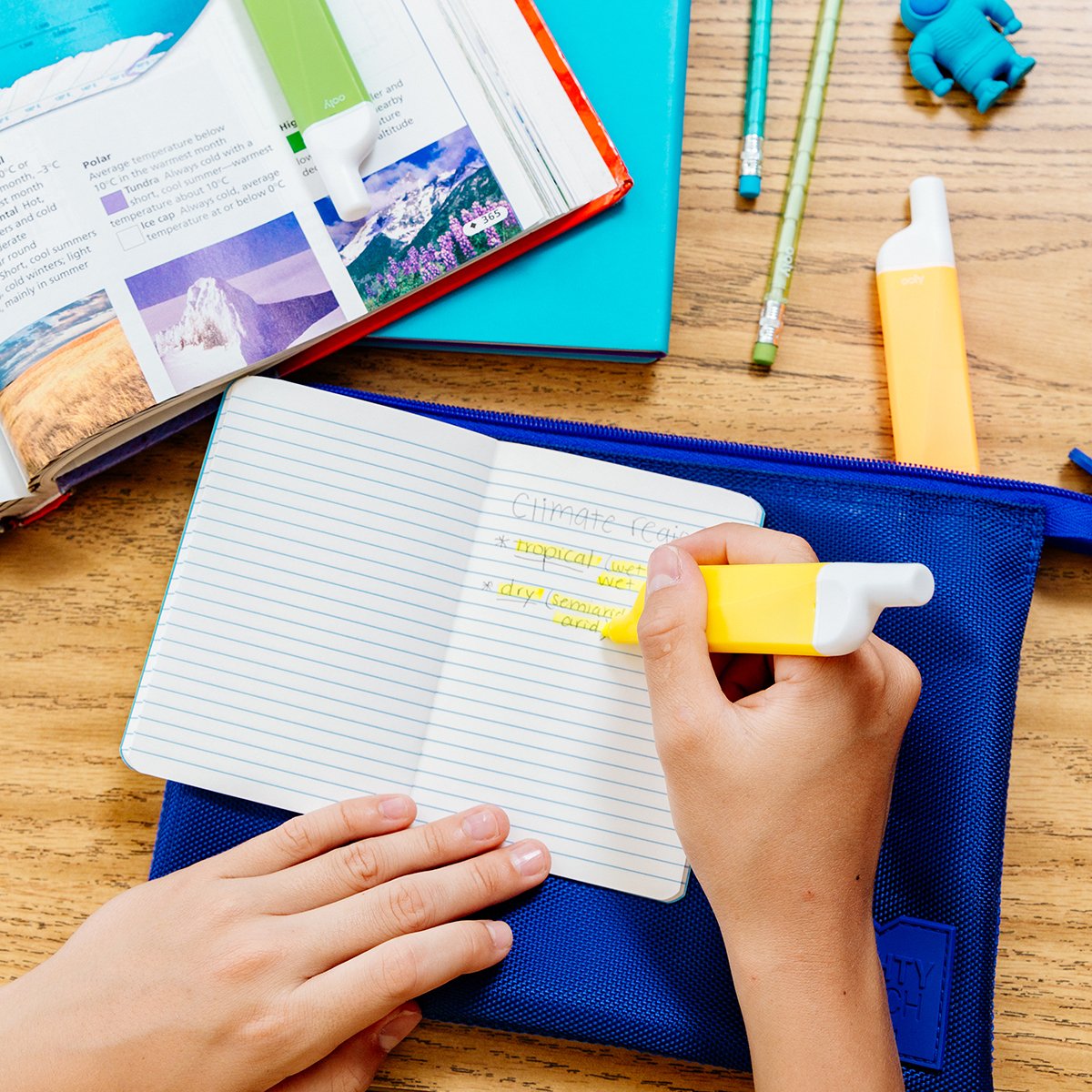 Image of kid's hands highlighting notes with yellow Do-Overs Highlighter
