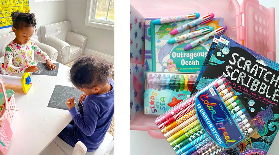 underwater themed art supplies and two girls sitting at white table