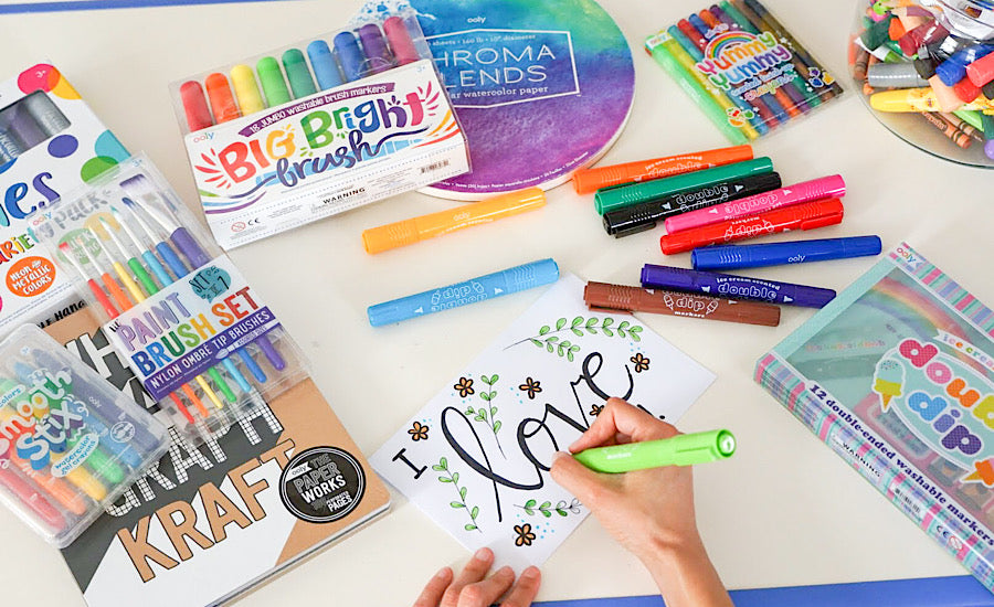 colorful art supplies on white surface