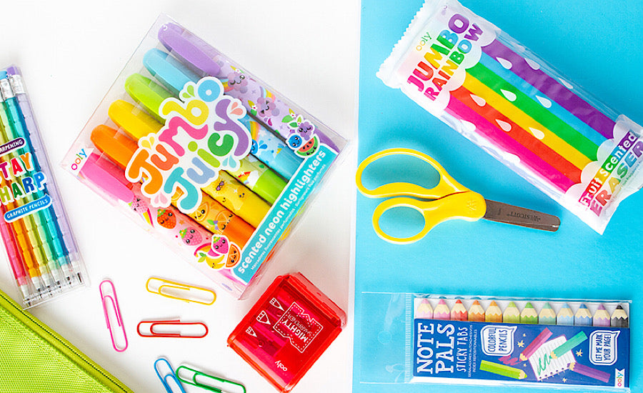 rainbow school supplies on colorful backgorund