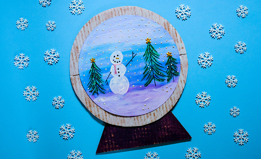 paper snow globe on blue background
