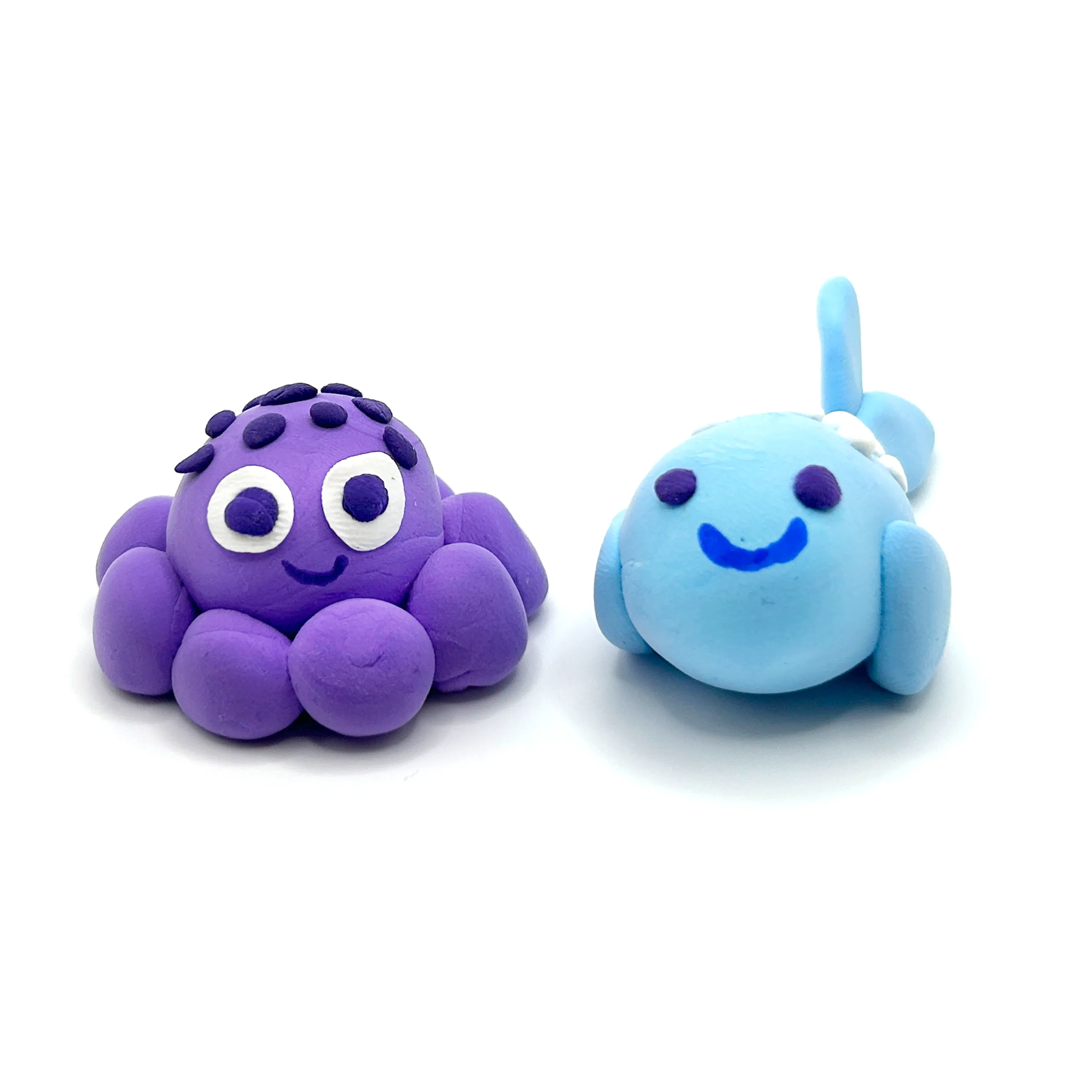 Two completed Creatibles animals from OOLY Creatibles Mini Air Dry Clay Kit - Ocean BFFs