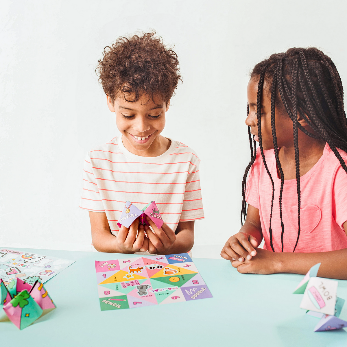 Kids playing with fortune teller from OOLY DIY Fortune Tellers Activity Kit