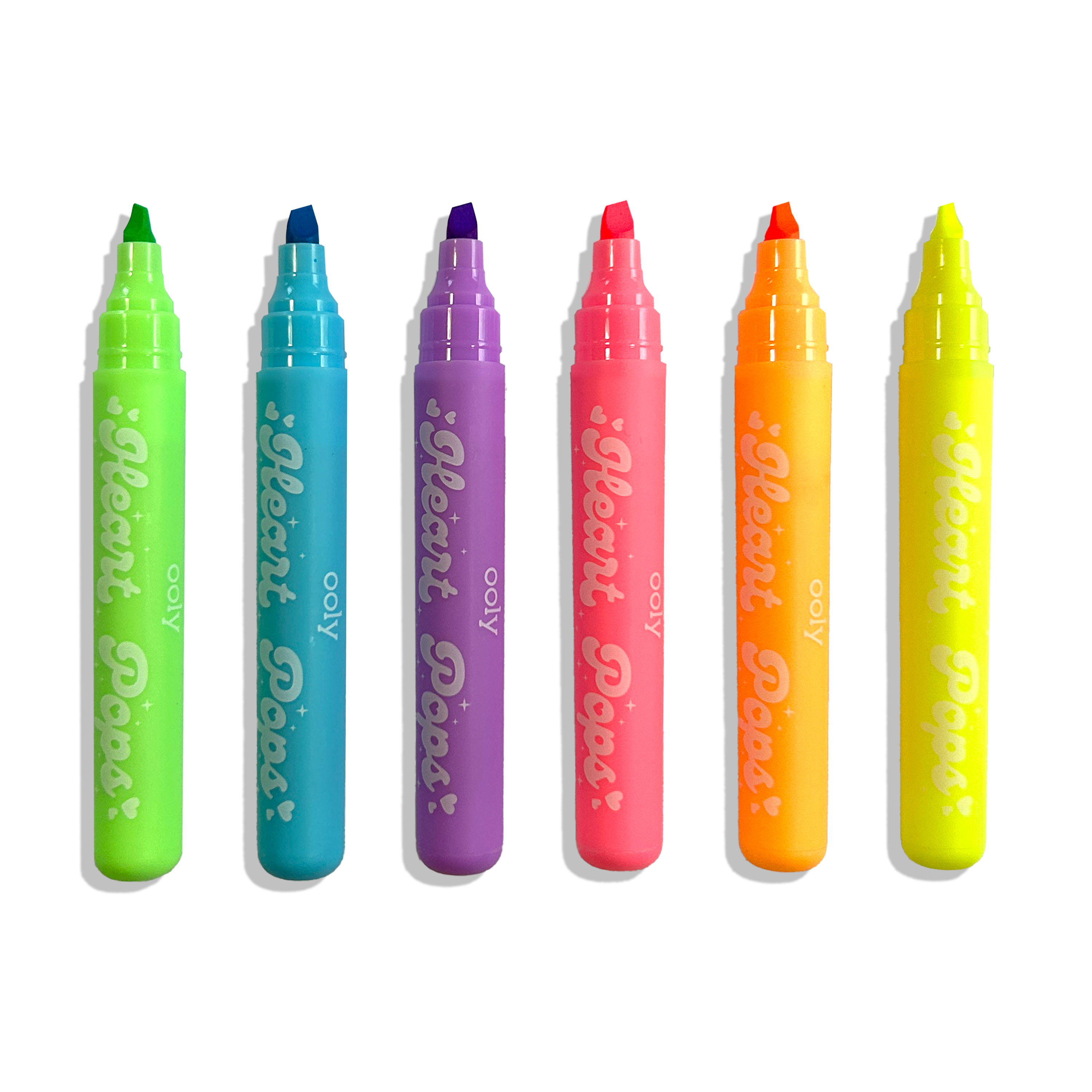 Row of uncapped OOLY Heart Pops Neon Highlighters on a white background