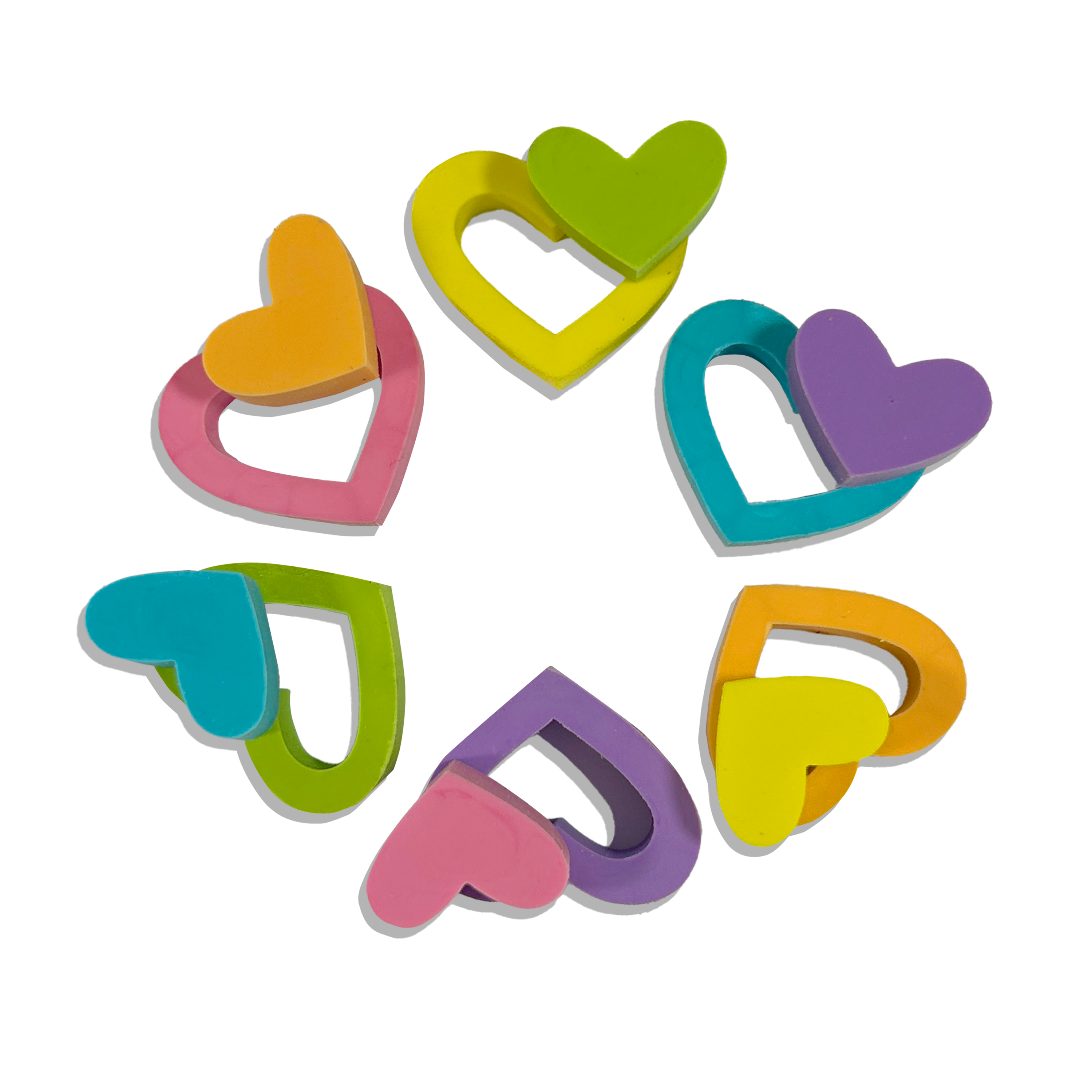 Six OOLY Hearts in Bloom Puzzle Erasers with the middles popped out on white background