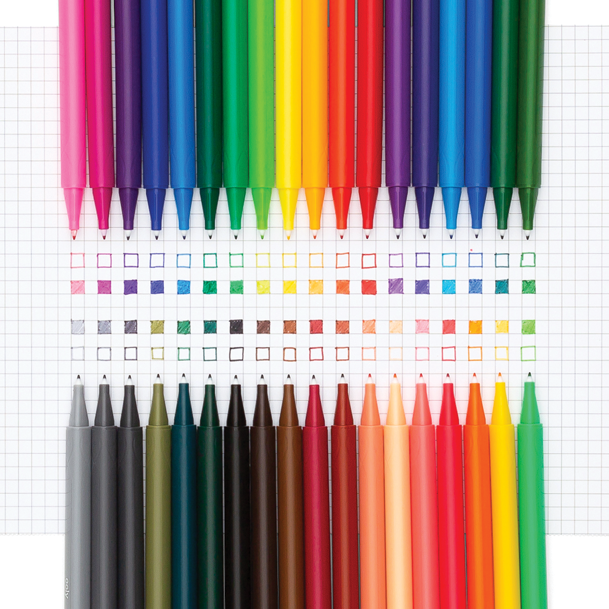 Seriously fine markers, with caps off, laid out on graph paper showing vibrant swatched colors