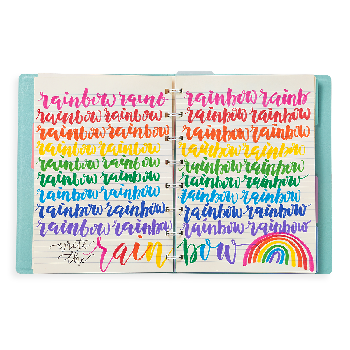 Image of planner open with rainbow written in brush lettering in rainbow colors