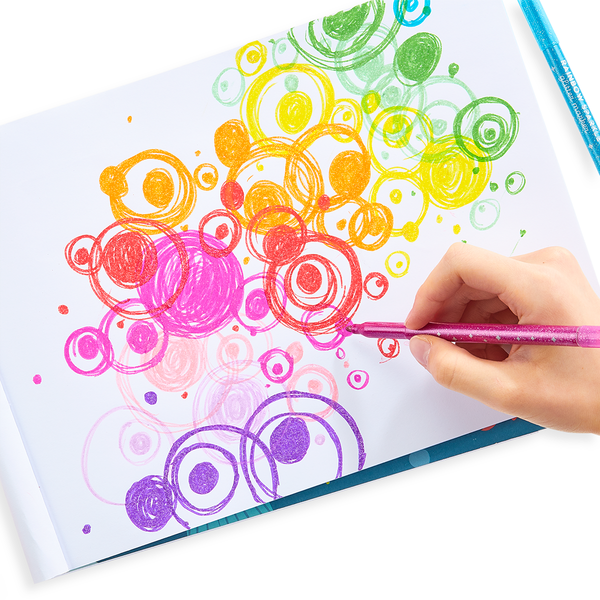 Circular art on a sketchbook with Rainbow Sparkle glitter marker